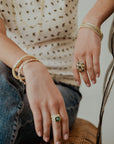 18 Karat Gold Emerald and Diamond Three Stone Ring