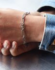 Platinum Paperclip Link Bracelet with Diamond Wheel