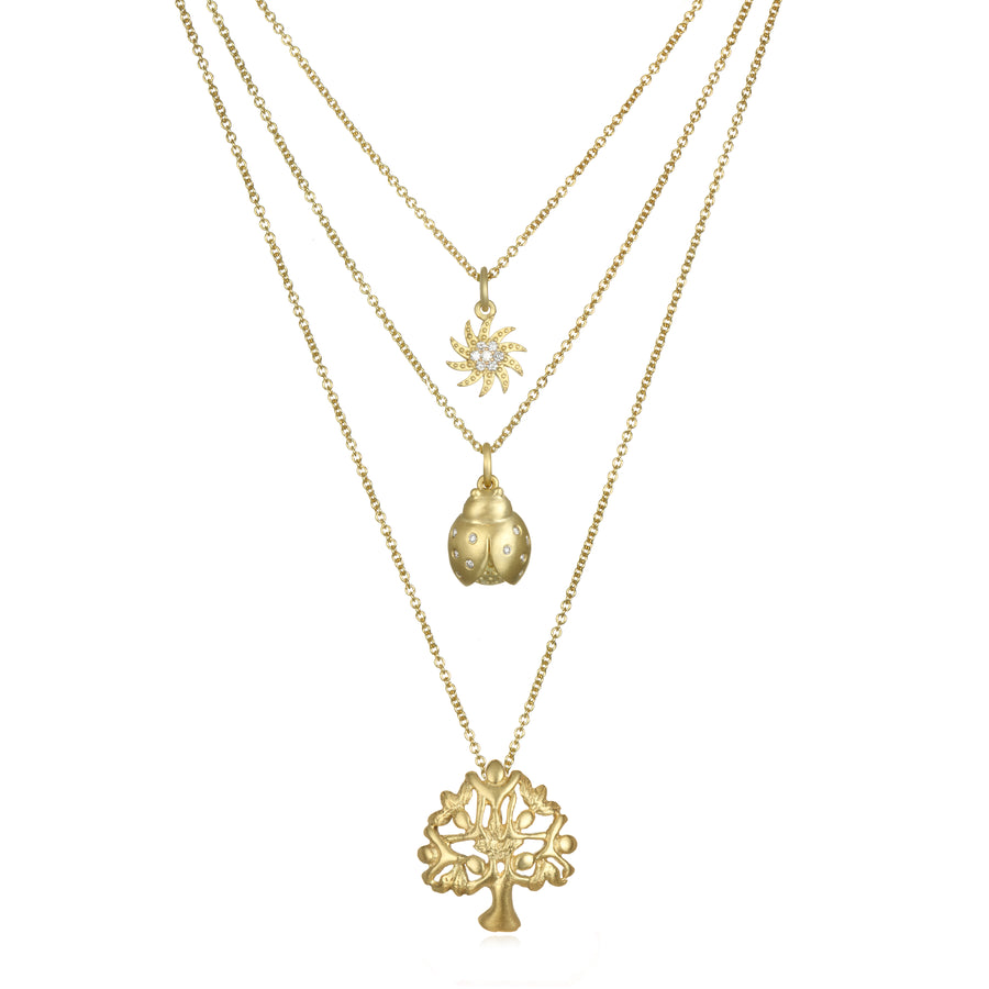 18 Karat Gold Diamond Sun Charm